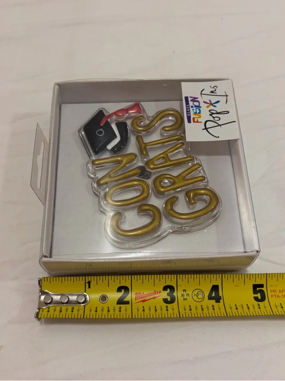 NIB Demdaco Glass Fusion Pop-Ins Gold Congrats with Black Cap